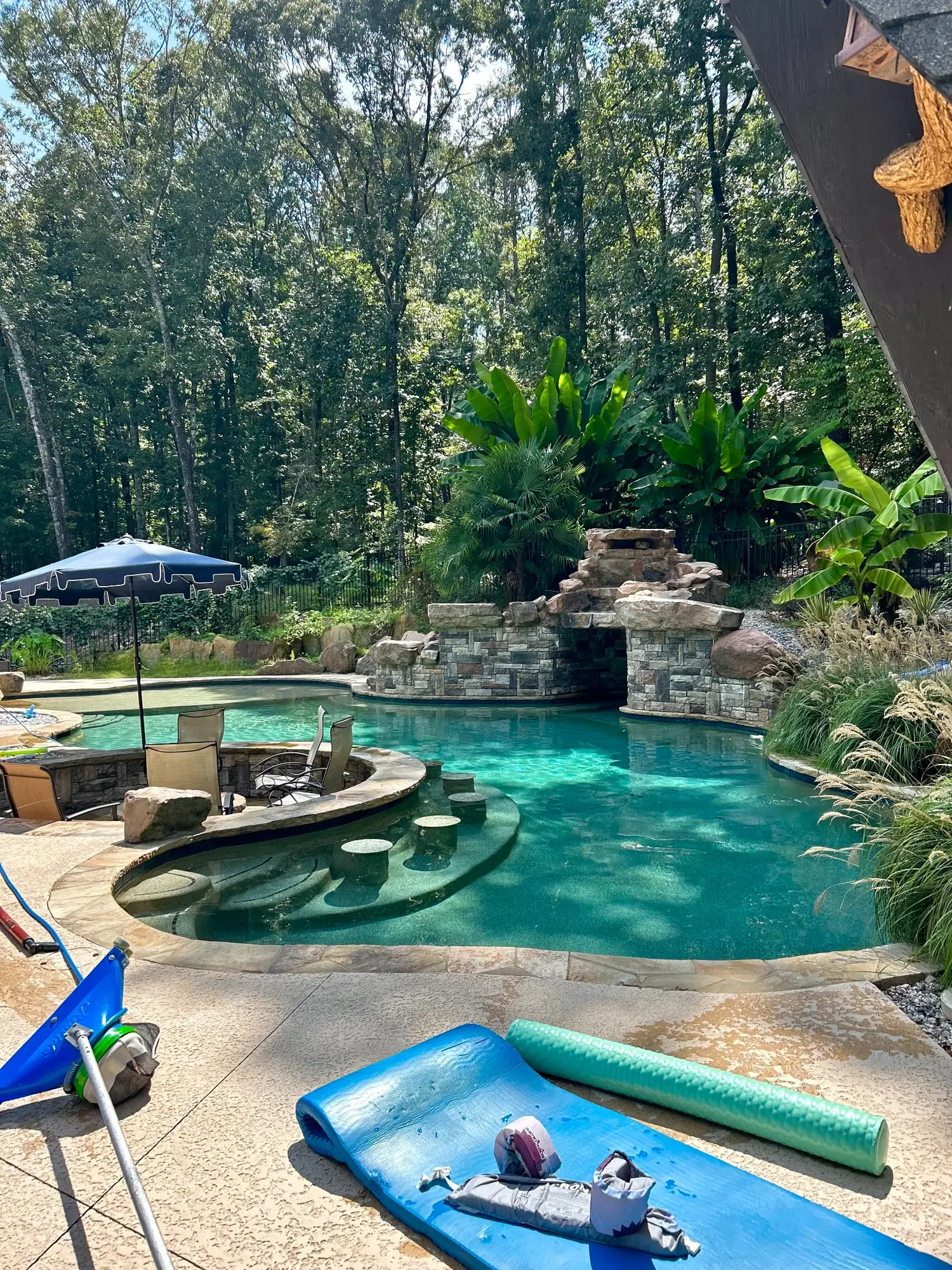 Closer view of a clear grotto pool with detailed rockwork