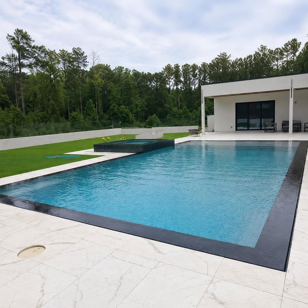 Modern pool professionally maintained by Clayton's Luxury Pools